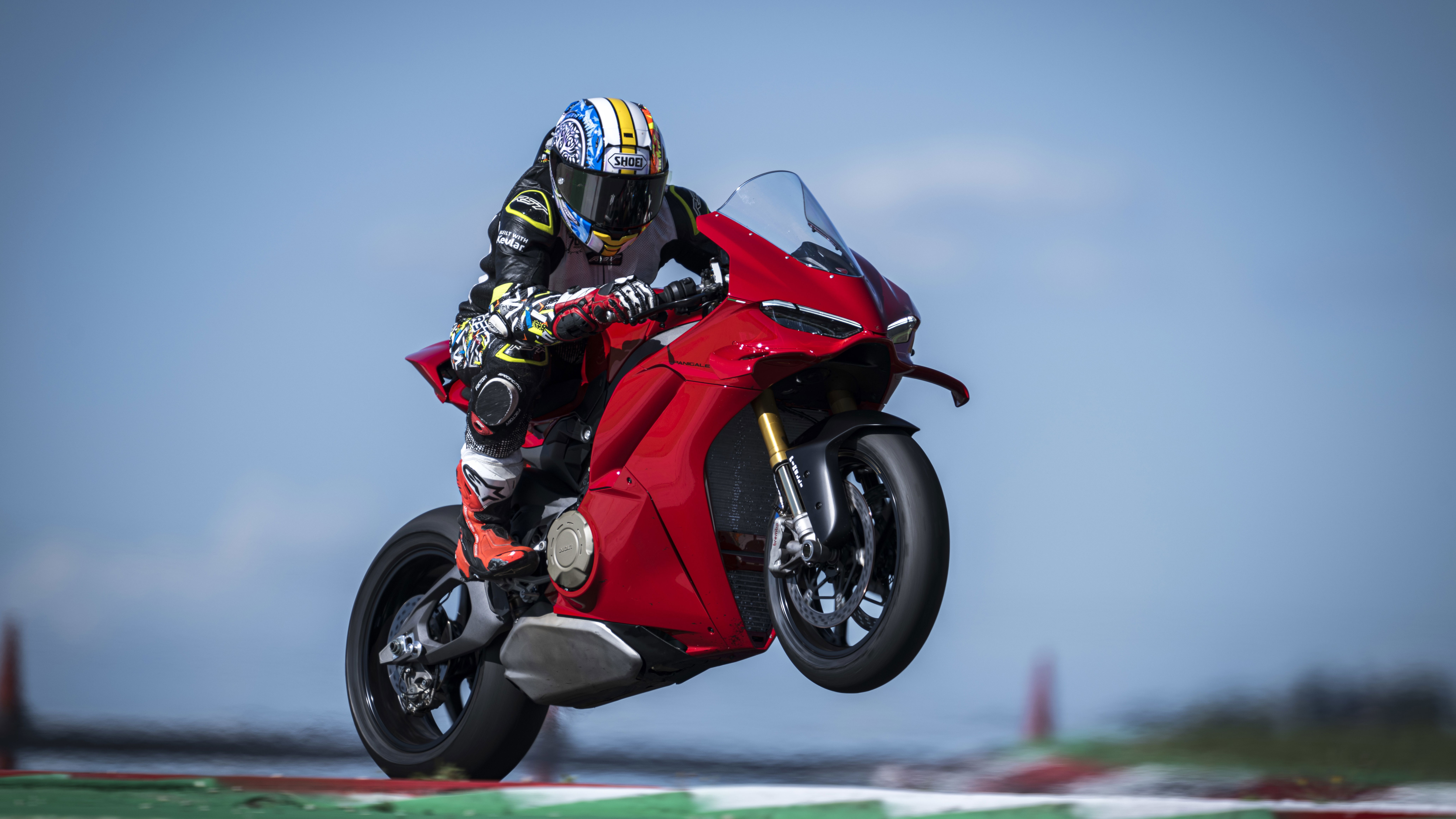 A Ducati pulling a wheelie on track