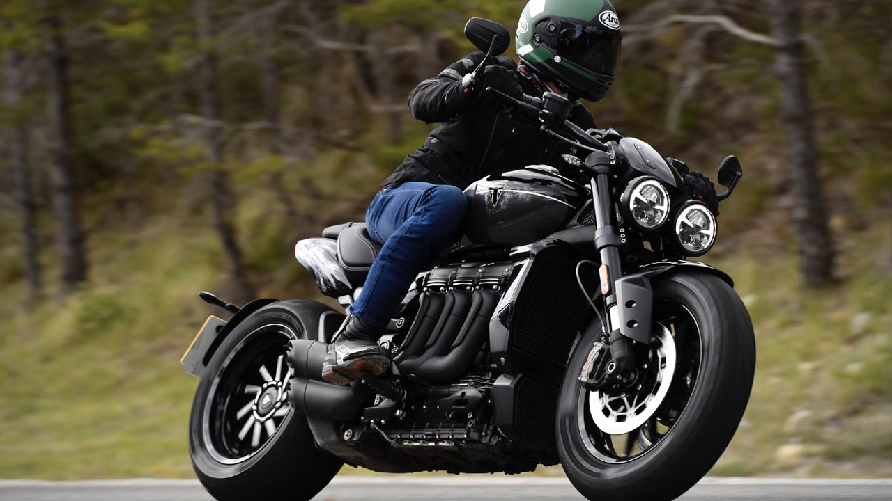 A motorcycle being ridden along a road